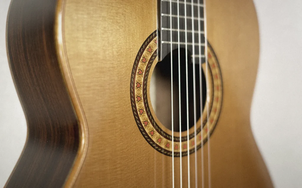 Mosaic rosette set into the cedar soundboard of an Arrius classical guitar
